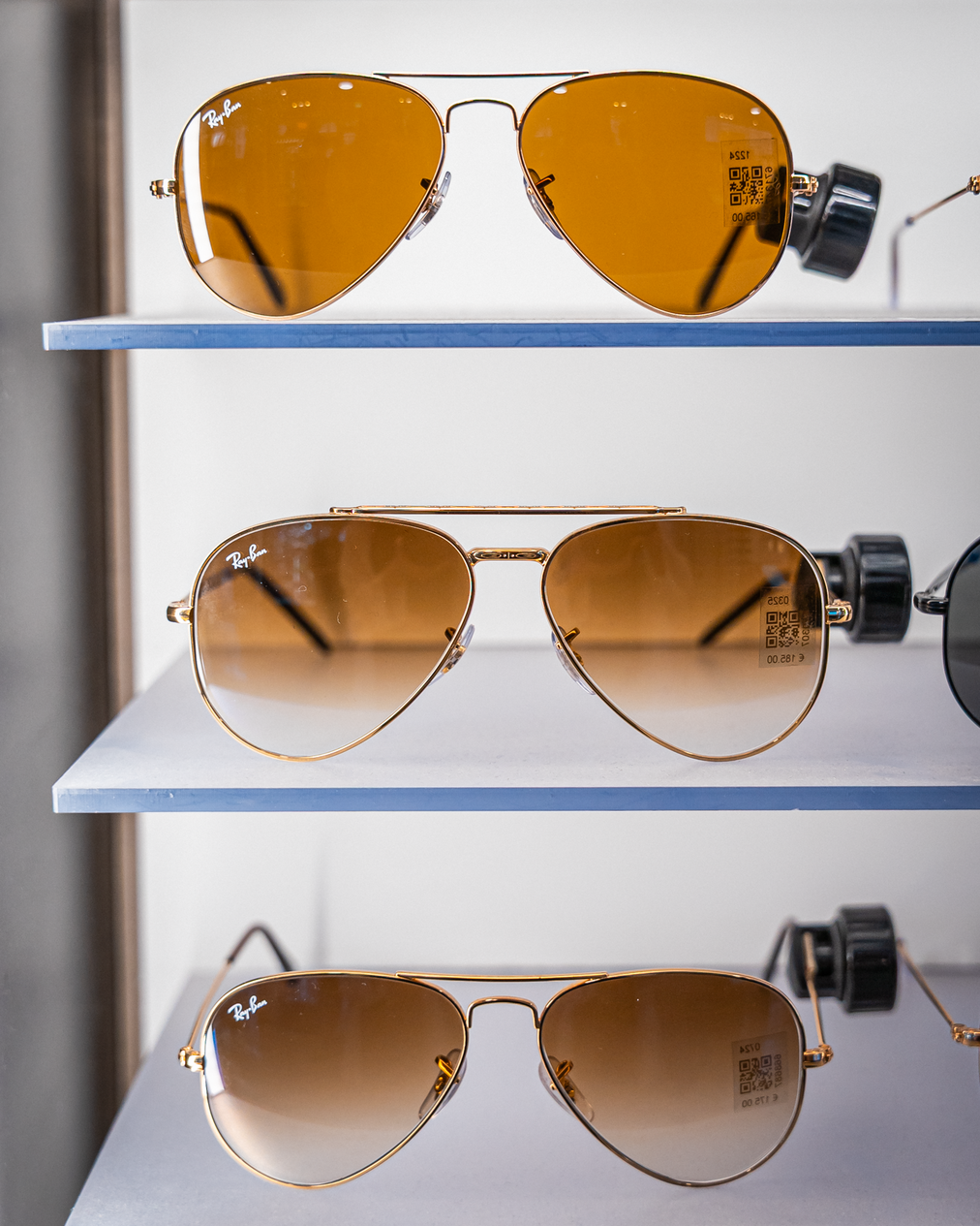 Three different types or Ray Ban Aviator on a shelf 